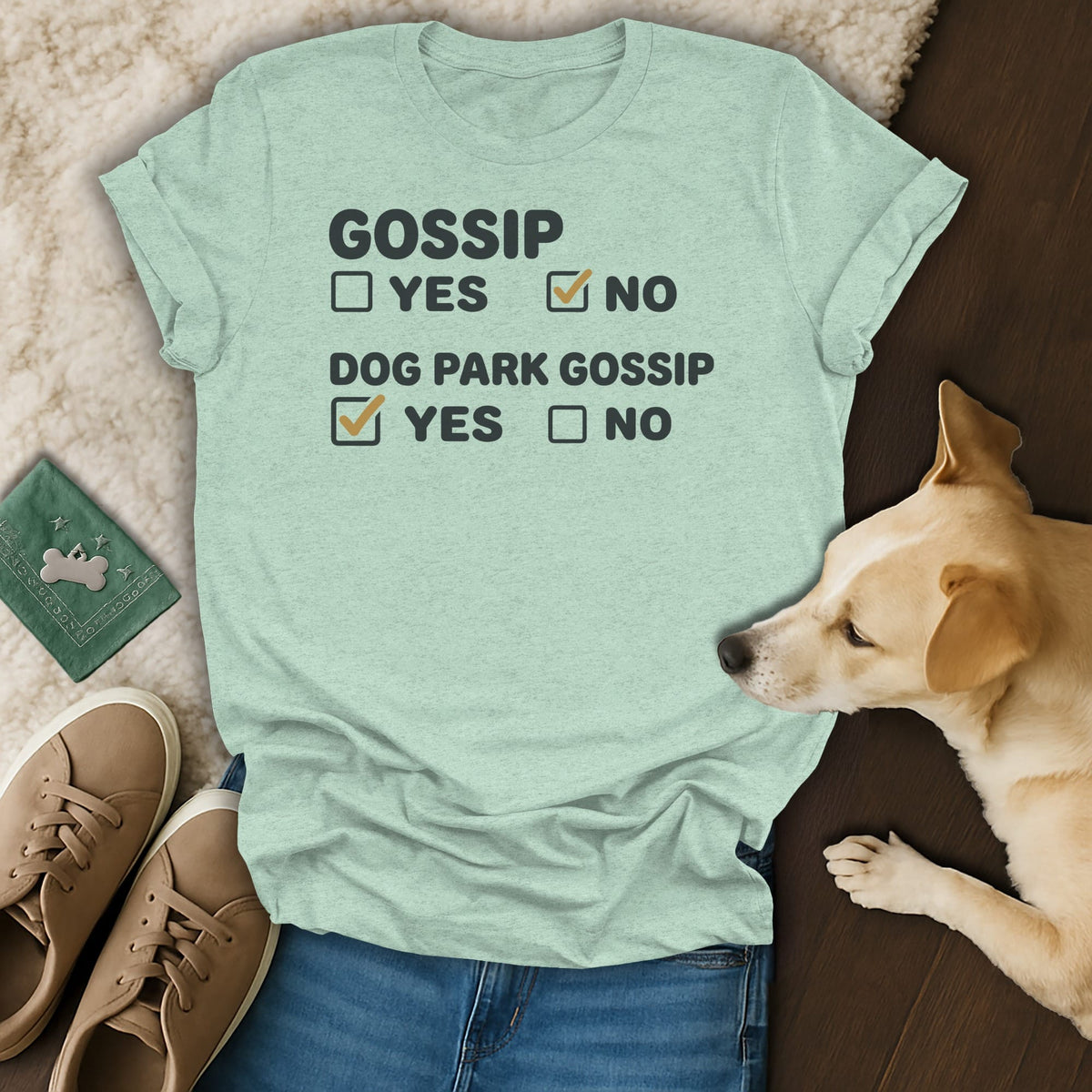 Light mint t-shirt with black text and checkboxes, reads "GOSSIP YES NO DOG PARK GOSSIP YES NO".