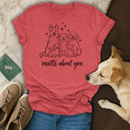T-shirt with line art of five dogs and text "mutts about you".