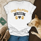 White t-shirt with "Crazy Dog Person & Proud" text and paw print graphics.