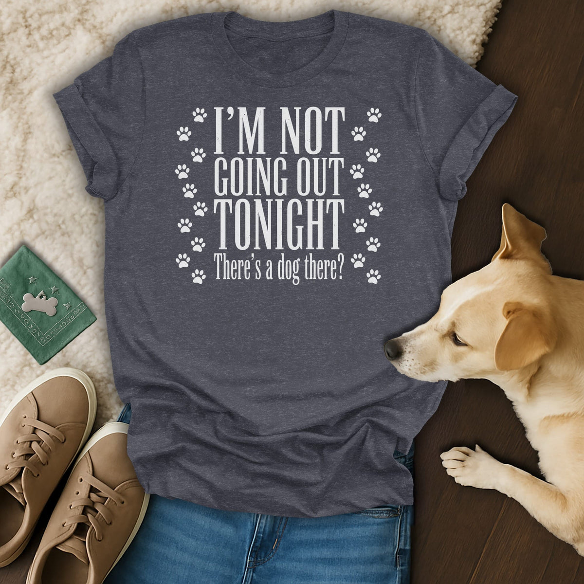 Charcoal t-shirt with white text "I'm Not Going Out Tonight, There's a dog there?" and paw prints.