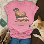 Pink t-shirt with American flag silhouette dogs and city skyline, "America's 250th" text.