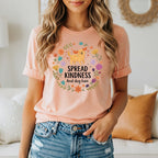 Peach t-shirt with "Spread Kindness and dog hair" text and dog graphic.