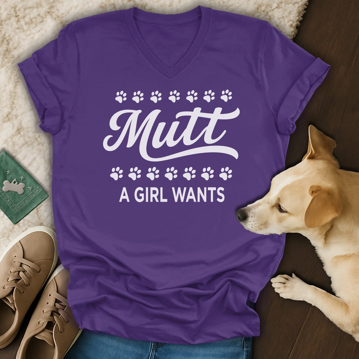 Purple V-neck t-shirt with white text "Mutt A GIRL WANTS" and paw prints.