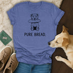 T-shirt with line drawing of a dog holding a baguette and text "PURE BREAD."