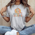 Grey t-shirt with colorful dog inside pumpkin graphic that reads "Cutest in the Patch".
