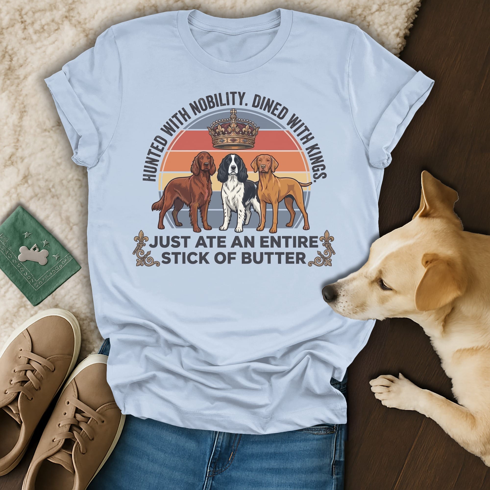 T-shirt with three dogs and text "Hunted with nobility. Dined with kings. Just ate an entire stick of butter."