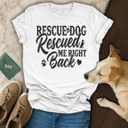 White t-shirt with "Rescue Dog Rescued Me Right Back" text and dog graphic.