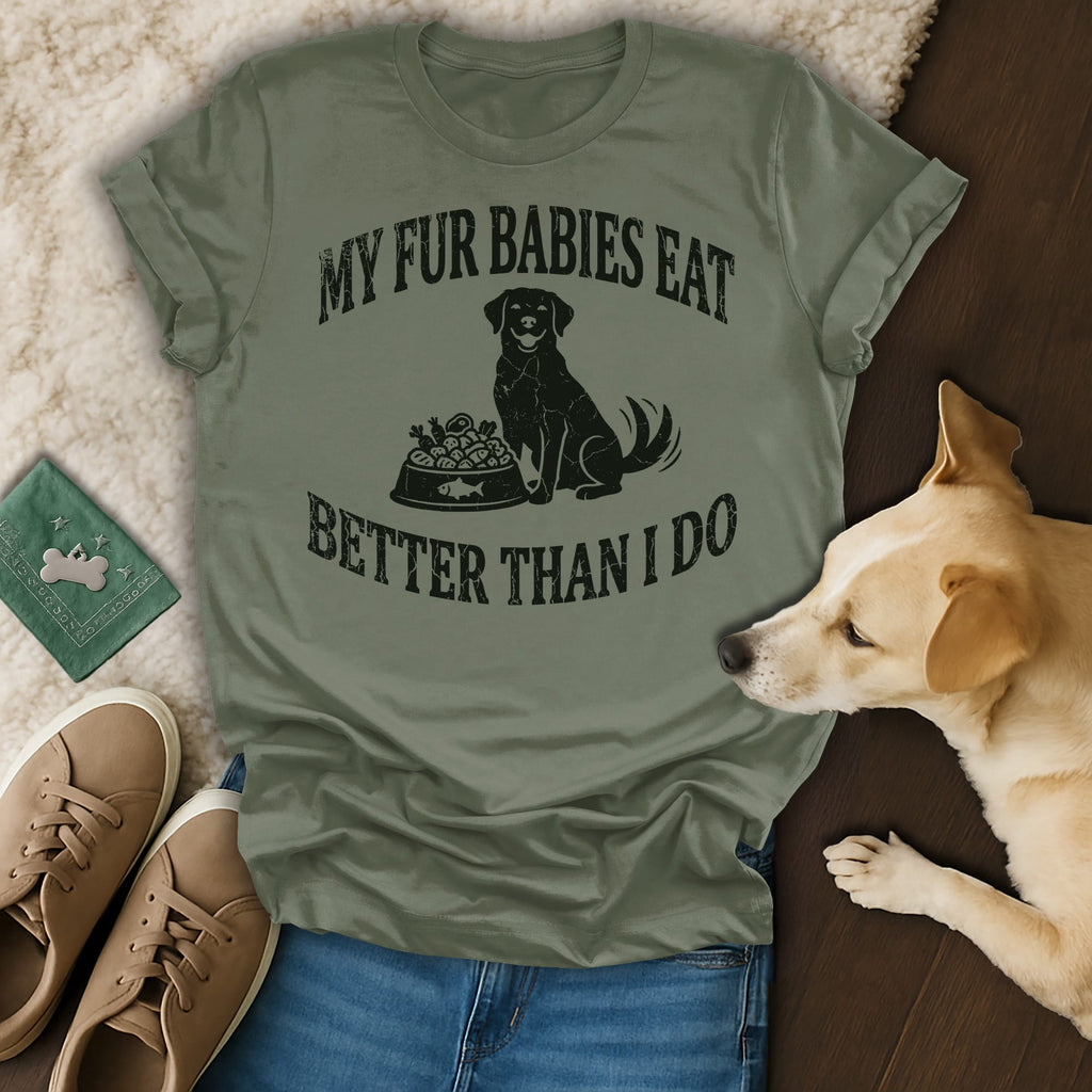 Dog wearing "My Fur Babies Eat Better Than I Do" t-shirt with dog food bowl.
