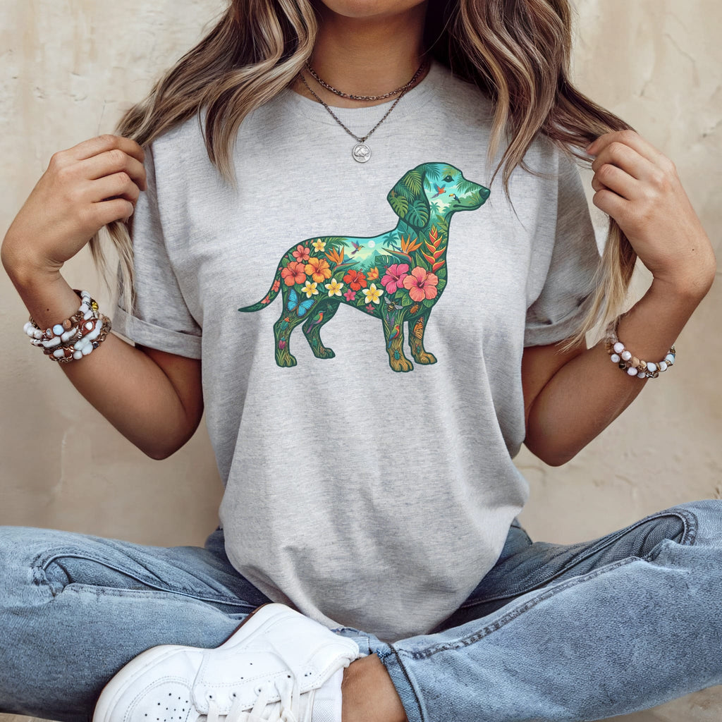 Dachshund outline filled with colorful tropical flowers and leaves on gray t-shirt.