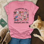 Pink t-shirt celebrating 250 Pawtriots since 1776 with dogs in patriotic attire.