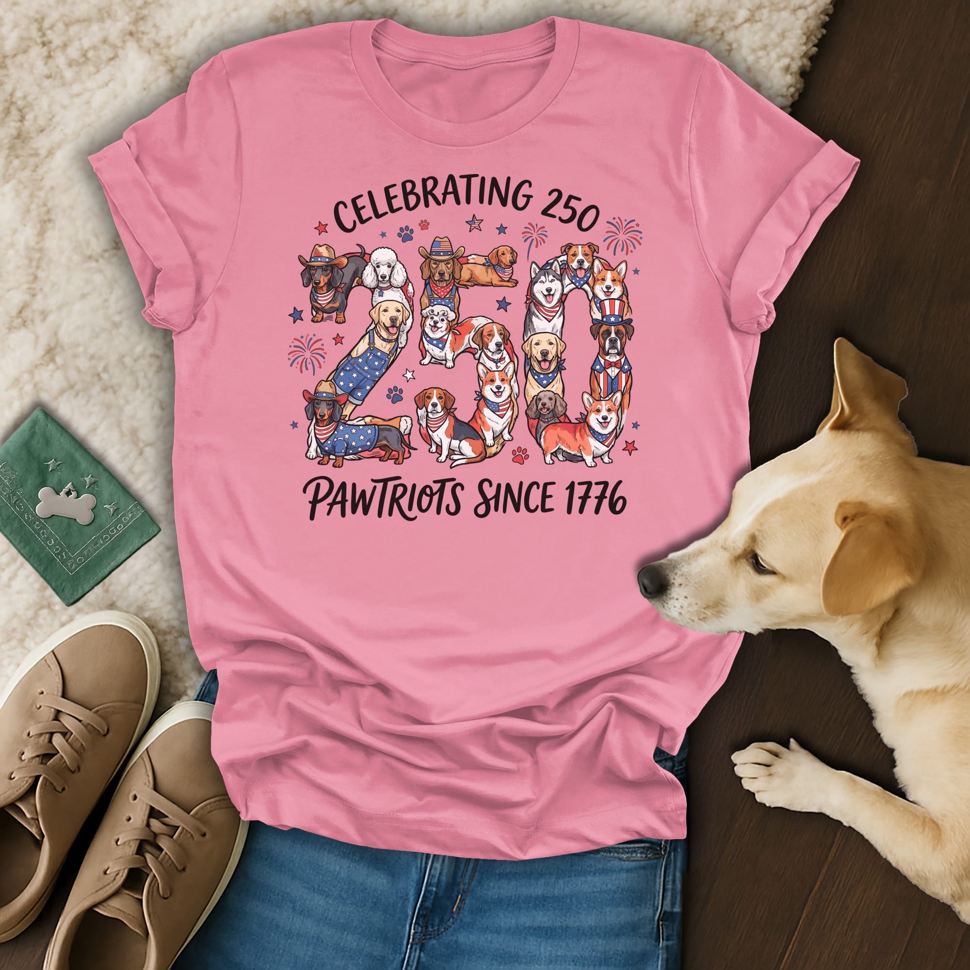 Pink t-shirt celebrating 250 Pawtriots since 1776 with dogs in patriotic attire.
