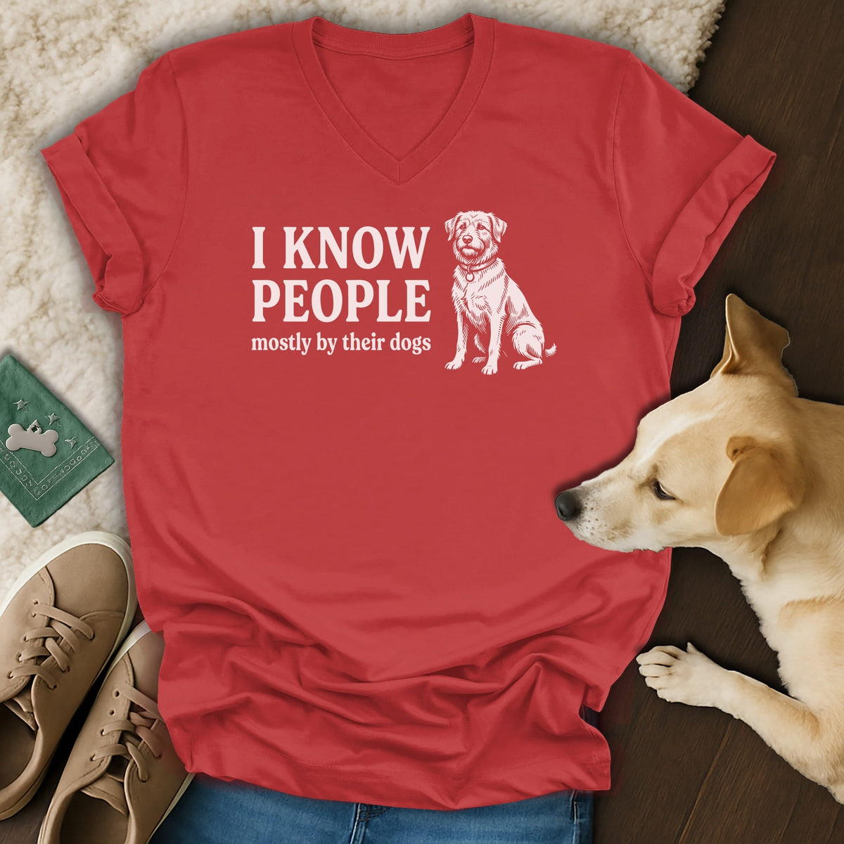 Red v-neck t-shirt with white text and dog graphic: "I KNOW PEOPLE mostly by their dogs".