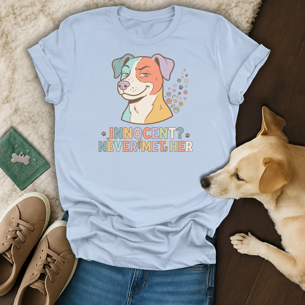 Light blue t-shirt with colorful dog graphic and text "Innocent? Never met her."
