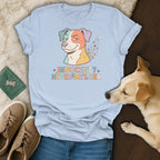 Light blue t-shirt with colorful dog graphic and text "Innocent? Never met her."