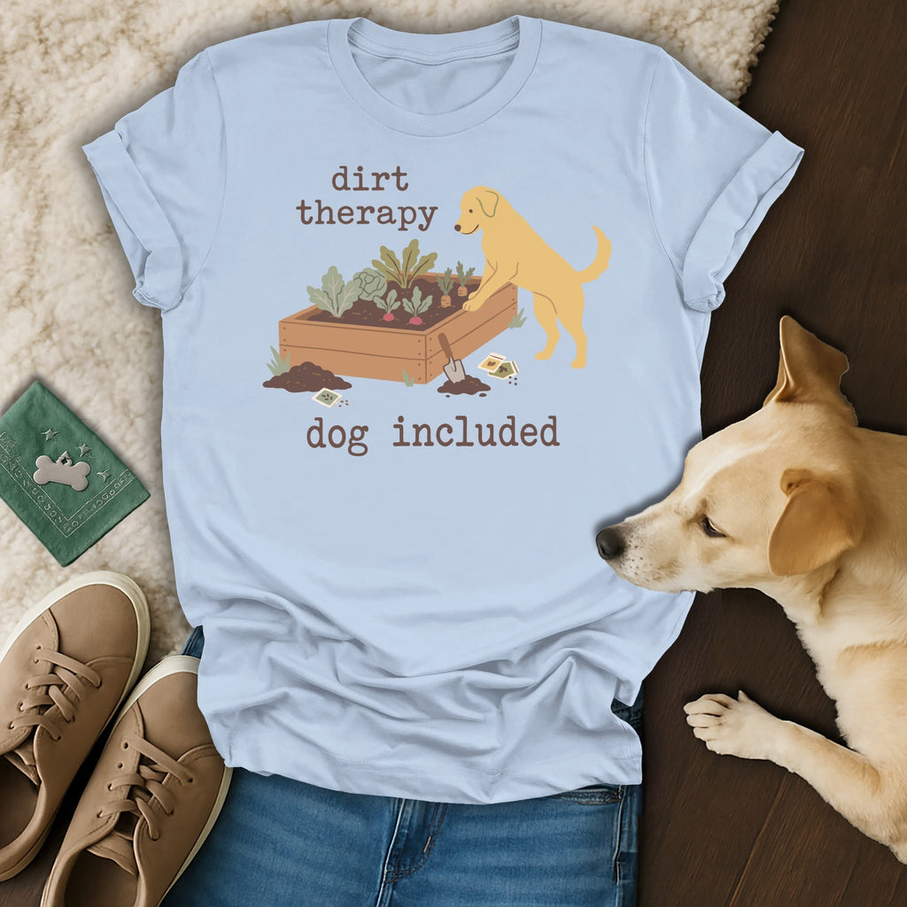 Light blue t-shirt graphic with text "dirt therapy dog included" and a golden retriever near a planter.