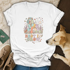 White v-neck t-shirt with a pastel poodle wearing a flower crown and "BEST IN GROW" text.