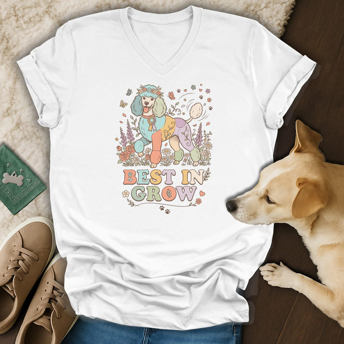 White v-neck t-shirt with a pastel poodle wearing a flower crown and "BEST IN GROW" text.