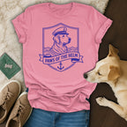 Pink t-shirt with a dog wearing a captain's hat and the text "Paws of the Helm".
