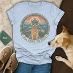 Golden retriever wearing sunglasses and captain's hat on a boat, "All Paws On Deck" text.