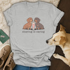 Two dachshunds share a milkshake with the text "sharing is caring".