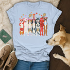 Light blue t-shirt with cartoon dogs playing pickleball and holding a trophy.