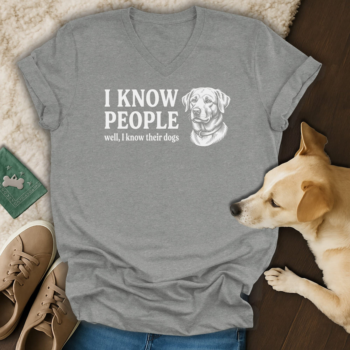 Grey v-neck t-shirt with "I KNOW PEOPLE well, I know their dogs" and dog illustration.