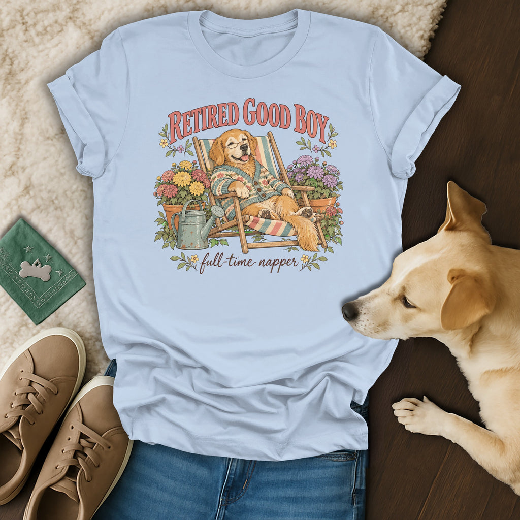 Light blue t-shirt featuring a retro cartoon of a golden retriever relaxing, surrounded by potted plants.
