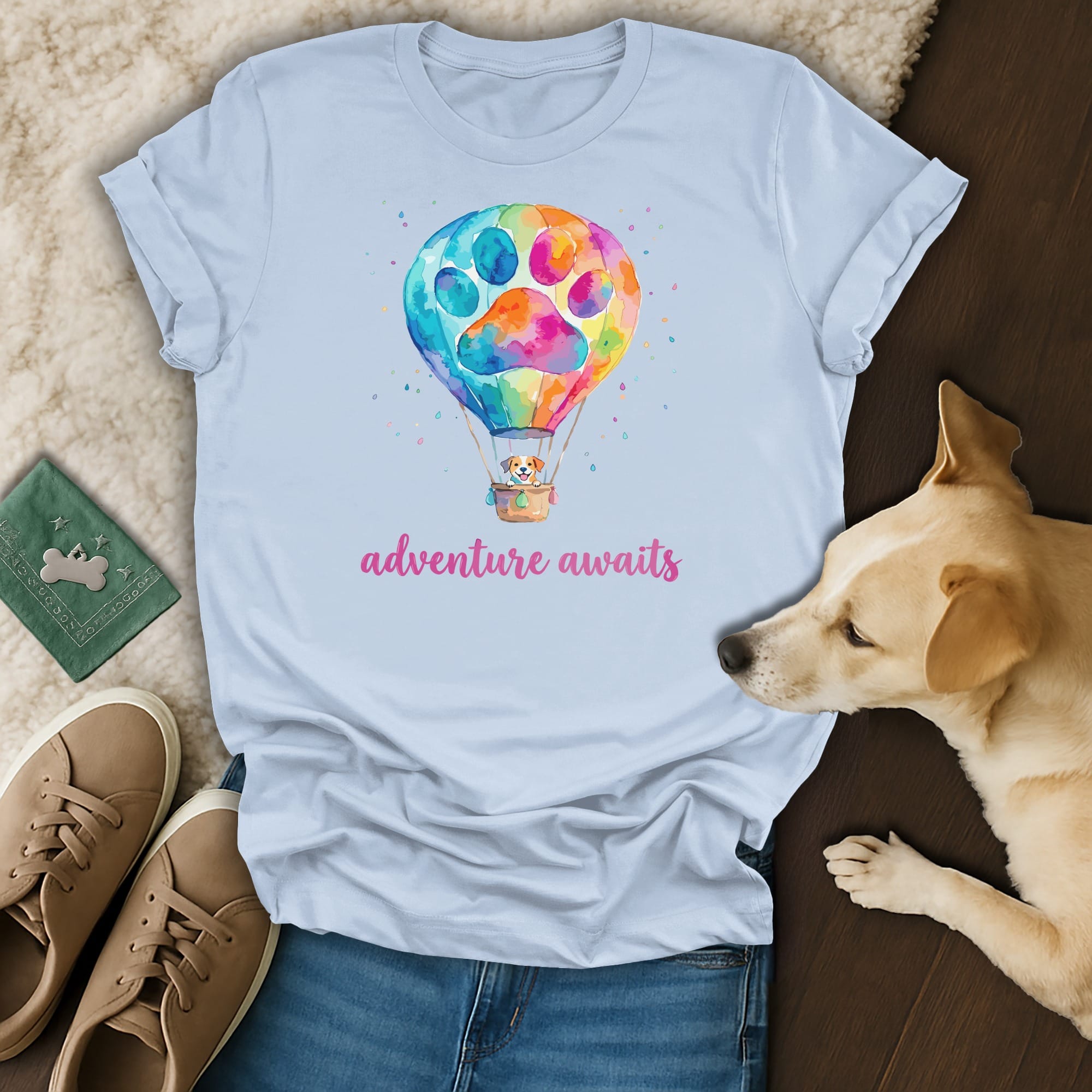 Light blue t-shirt with watercolor hot air balloon featuring a dog and "adventure awaits" text.