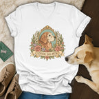 A white V-neck t-shirt featuring a vintage golden retriever illustration and the text Senior Dog Mom.