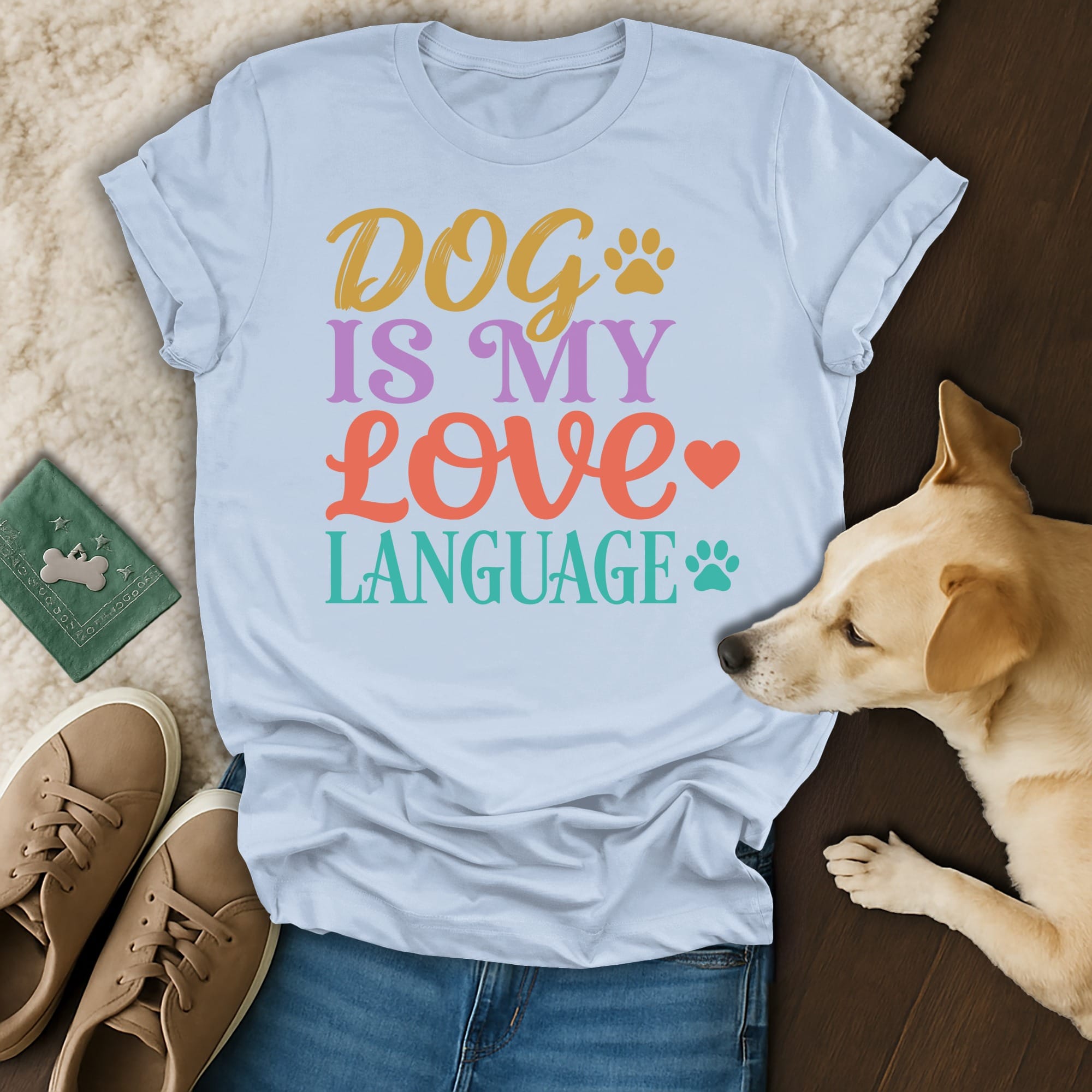 Light blue t-shirt with "Dog is my love language" text and paw print.