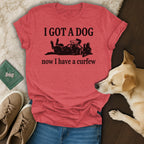 Red t-shirt with "I GOT A DOG now I have a curfew" text and dog graphic.