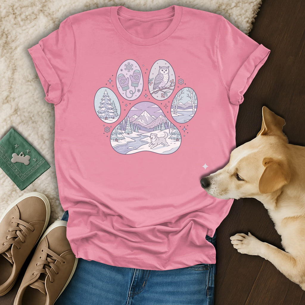 Pink t-shirt with a paw print filled with winter scenes and animals.