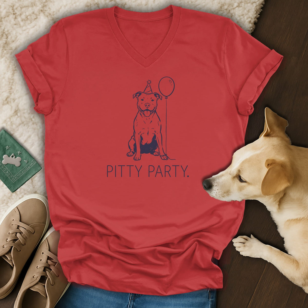 Red v-neck t-shirt with a blue pit bull wearing a party hat and holding a balloon.