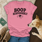 Pink t-shirt with "BOOP RESPONSIBLY" text and dog nose graphic.