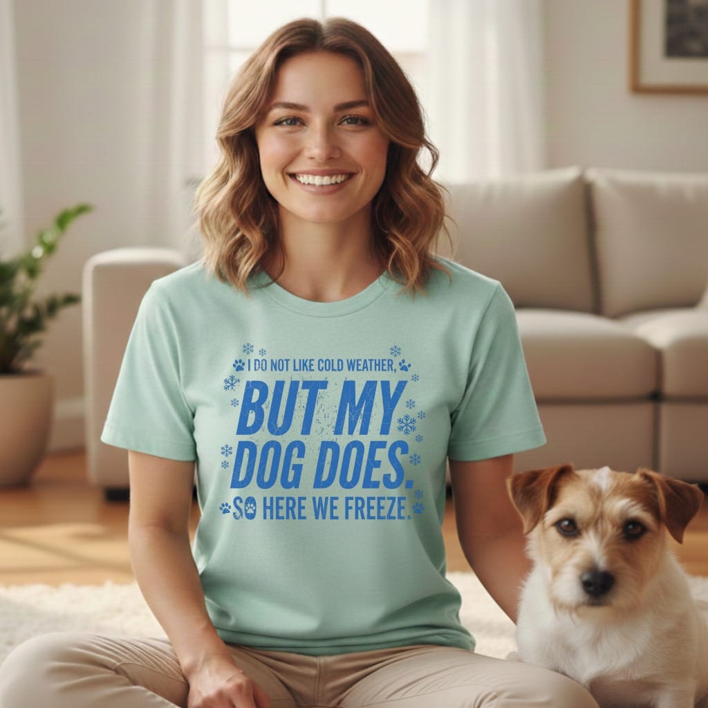 Woman and dog wearing a t-shirt that reads "I do not like cold weather, but my dog does. So here we freeze."