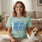 Woman and dog wearing a t-shirt that reads "I do not like cold weather, but my dog does. So here we freeze."
