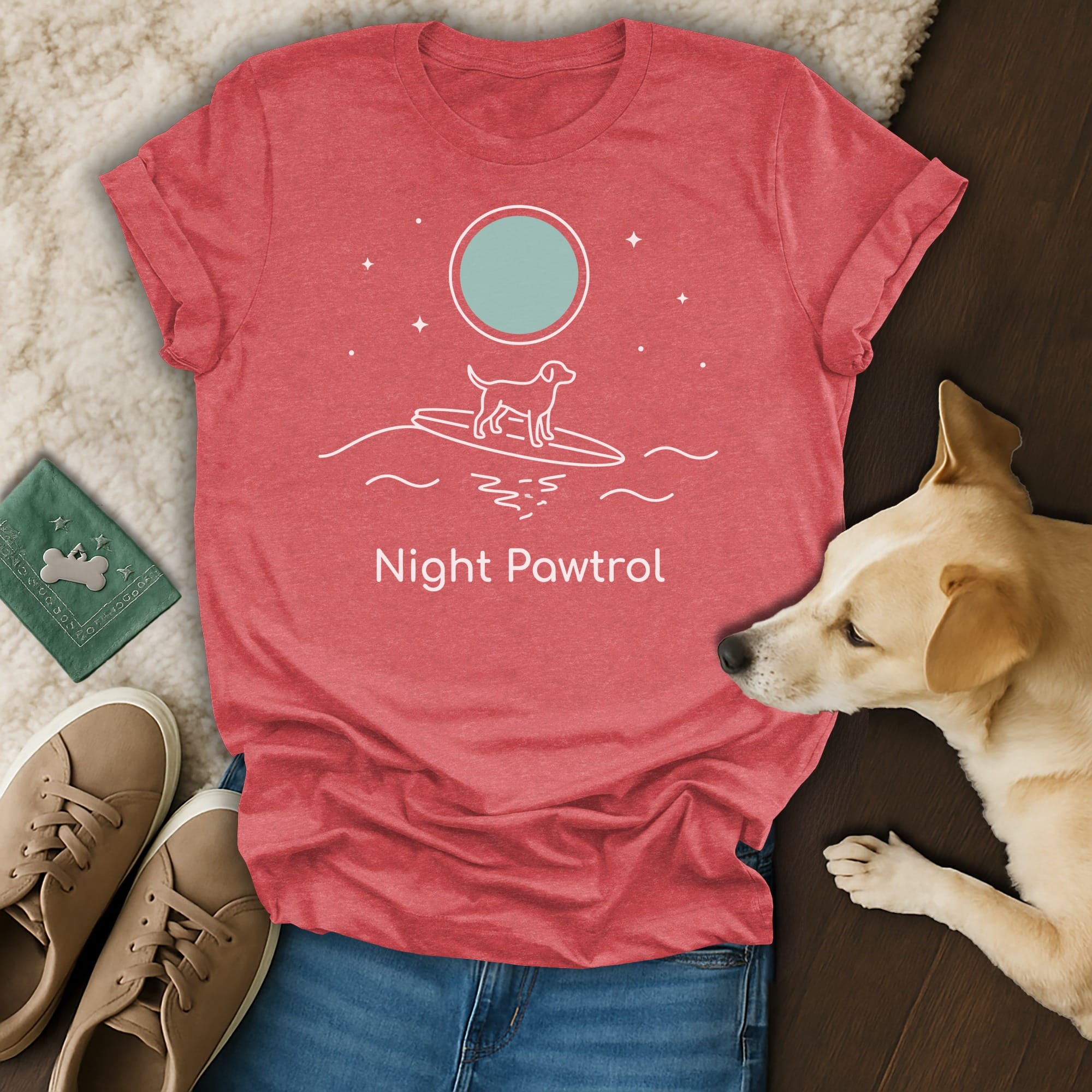 Red t-shirt with "Night Patrol" text and a dog on a surfboard under a moon.