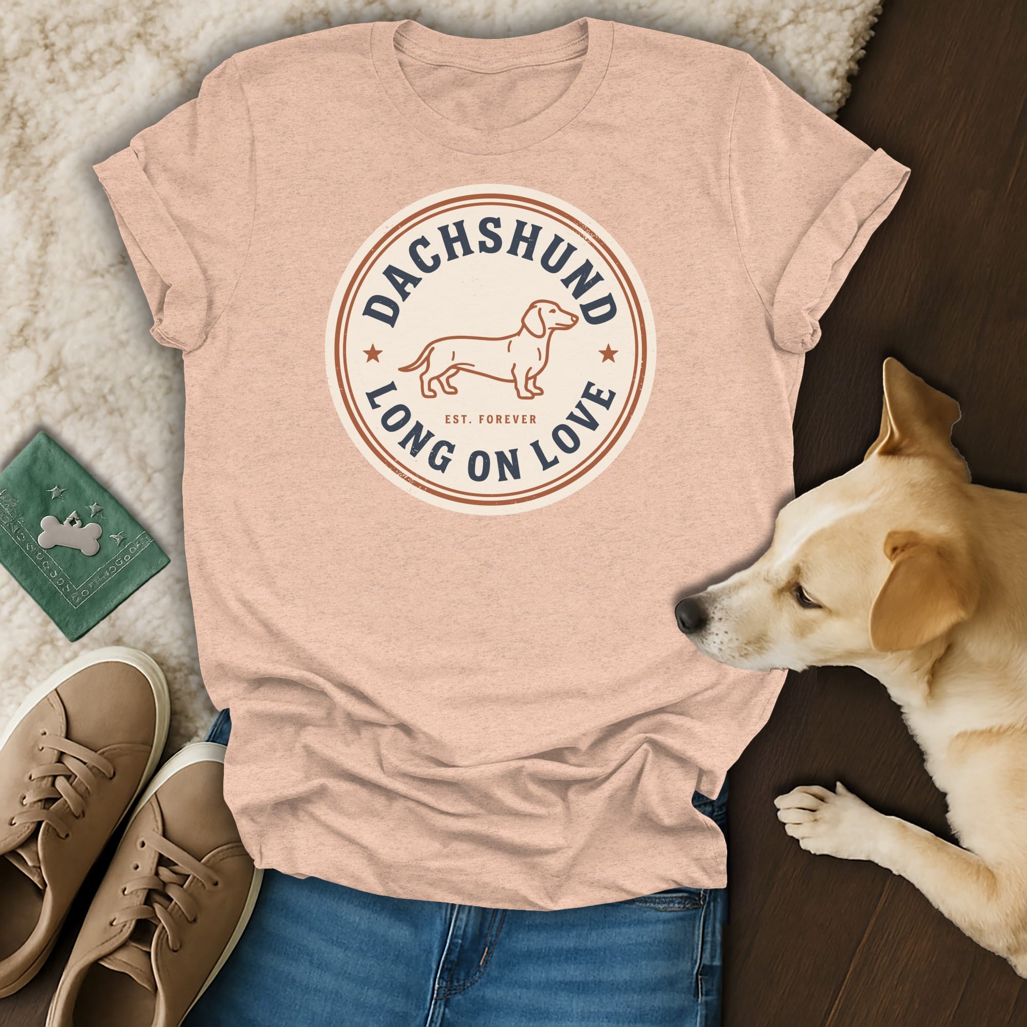 Peach t-shirt with a dachshund graphic and text "DACHSHUND LONG ON LOVE EST. FOREVER".