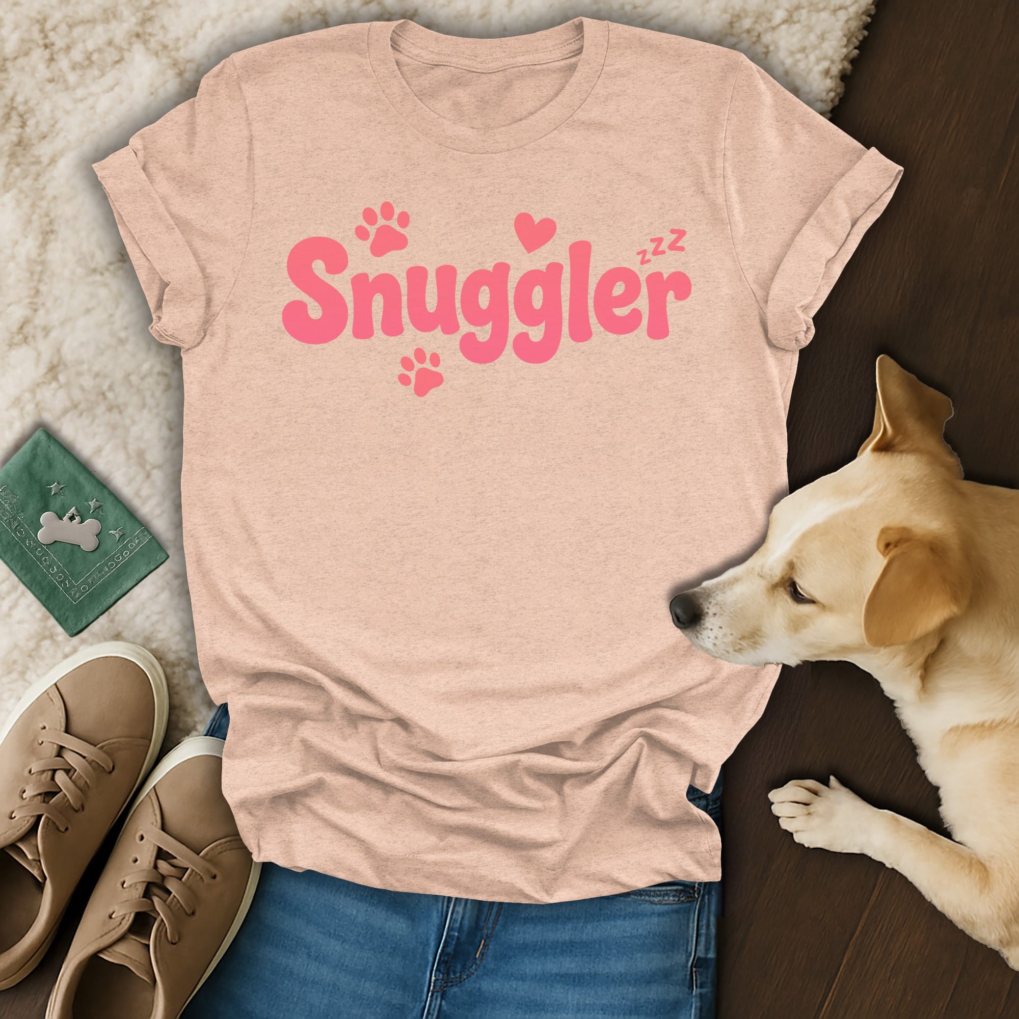 Peach t-shirt with "Snuggler" and paw prints in pink lettering.