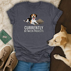 T-shirt with a beagle graphic and the text "CURRENTLY BETWEEN PROJECTS".