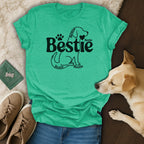 Green t-shirt with "Bestie" text and dog silhouette graphic.