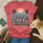 T-shirt with four golden retrievers on a cruise ship deck with palm trees.