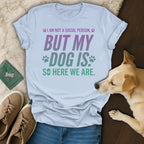 Light blue t-shirt with "I am not a social person, but my dog is, so here we are" text.
