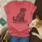 T-shirt with a black heart-patterned dog silhouette on a heathered coral background.