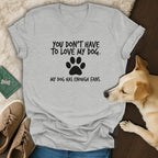 Light grey v-neck t-shirt with dog-themed text and paw print.