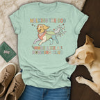 Light green t-shirt with graphic of a dog running and text "WALKING THE DOG MORE LIKE A RUNNING CLUB".
