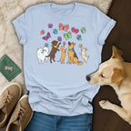Light blue t-shirt with cartoon dogs and colorful butterflies graphic.