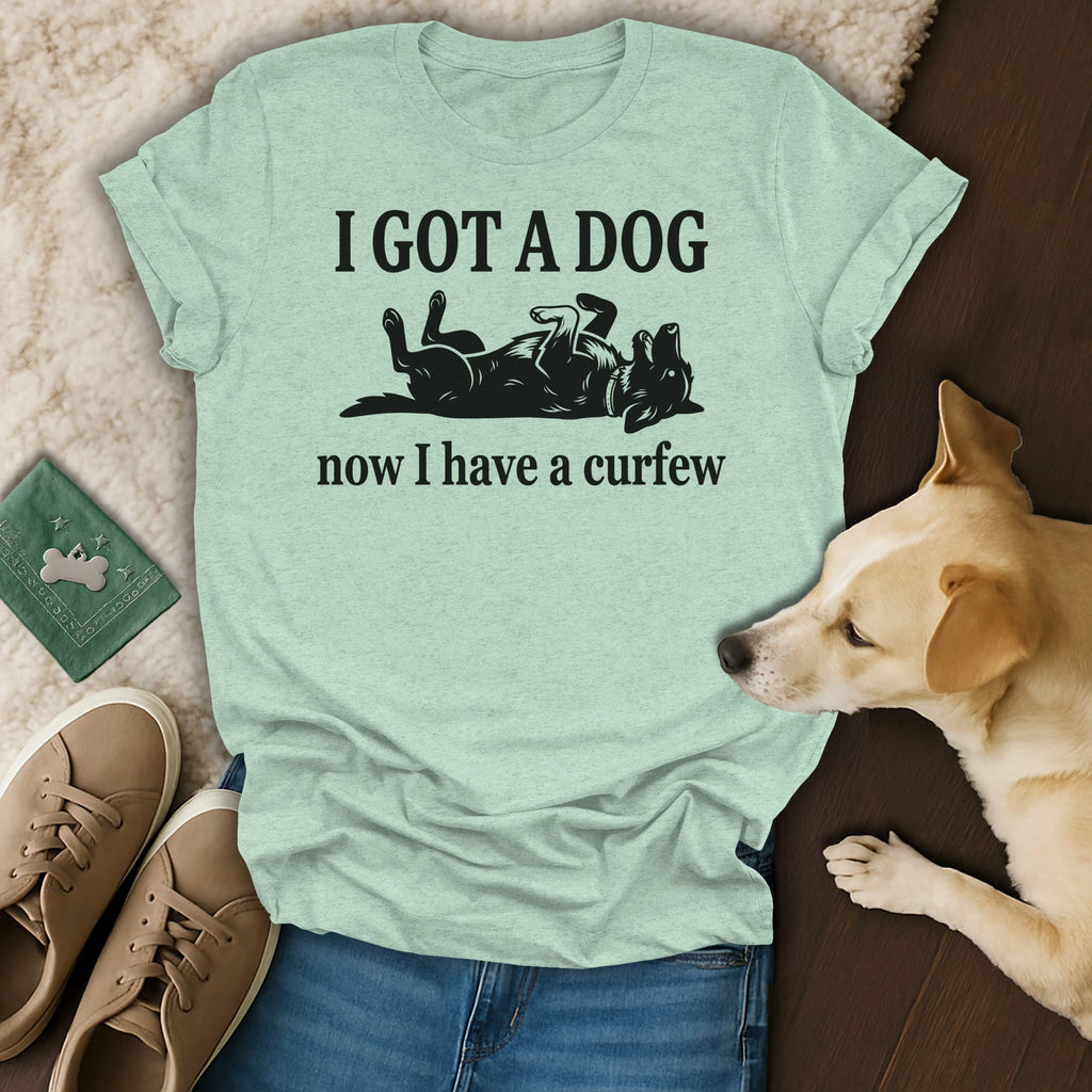 T-shirt with text "I GOT A DOG now I have a curfew" and a dog graphic.