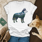 White t-shirt with husky silhouette filled with forest, mountains, and flowers.