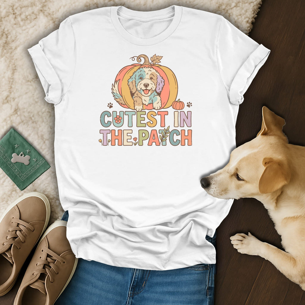 White t-shirt with a doodle dog in a pumpkin, saying "Cutest in the Patch."